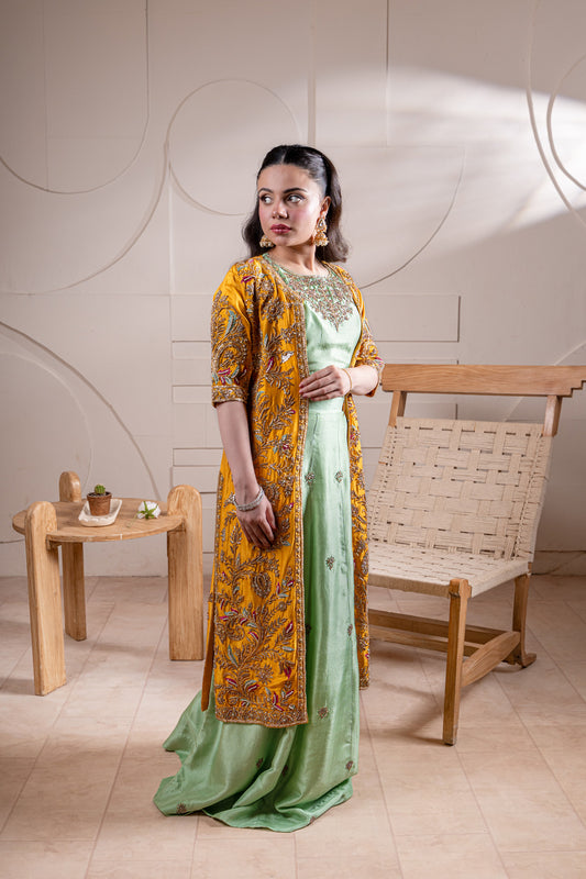 Side view green lehenga with yellow jacket